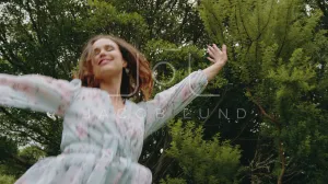 Cheerful woman dancing with joy