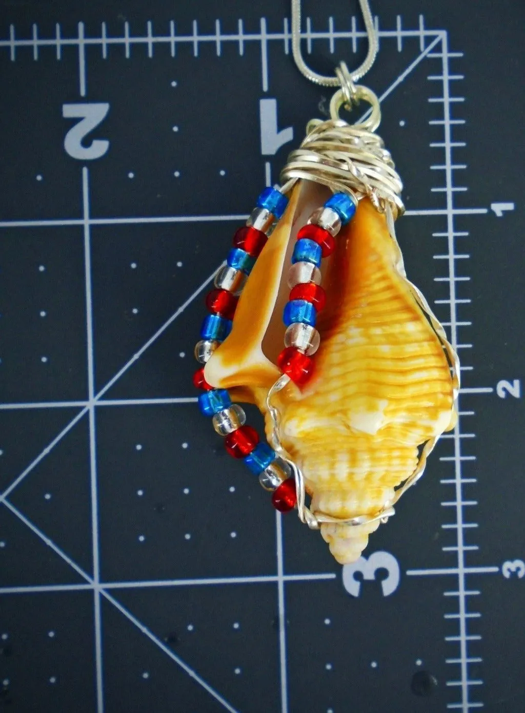 Handcrafted Fighting Conch Shell Pendant - Silver Wire Wrapped with Patriotic Glass Beads